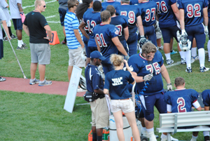 Helping football players as they take a break Helping football players as they take a break