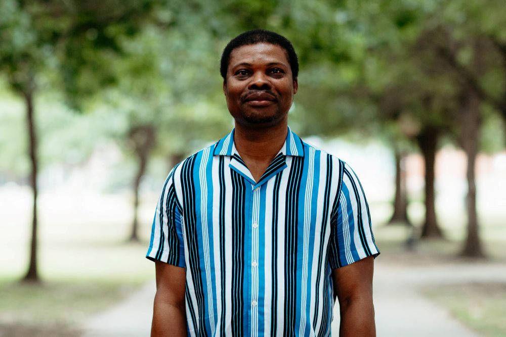 Man dressed nicely smiling at the camera