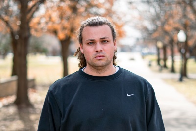 Man dressed nicely smiling at the camera