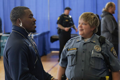 students speaking with law enforcement