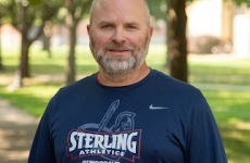 Man standing outside smiling at the camera