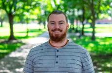 Man dressed nicely smiling at the camera Man dressed nicely smiling at the camera