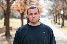 Man dressed nicely smiling at the camera