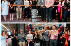Large group of people at a ribbon cutting