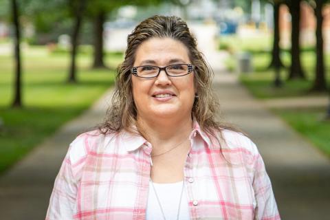 Female Professor looking at camera