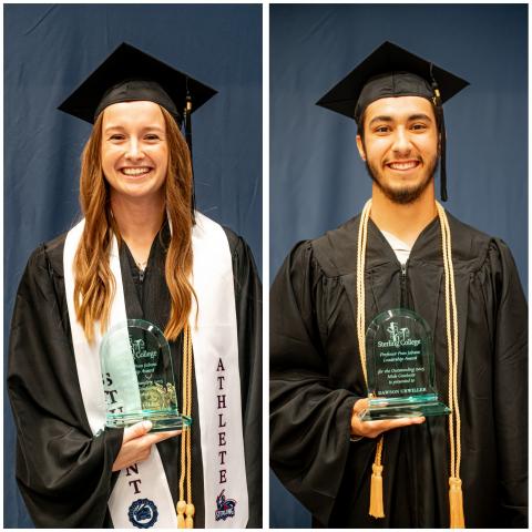 two students wearing graduation attire and holding glass awards two students wearing graduation attire and holding glass awards