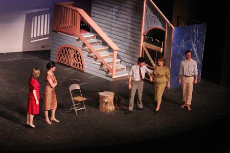 The actors and actresses rehearse a scene from Picnic during tech week.