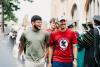students walking towards camera smiling